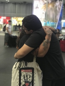 Interviewee Ana Laura hugging her youngest boy at the airport in Mexico City