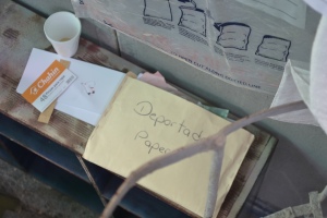 File folder on bench labeled "deportation papers"