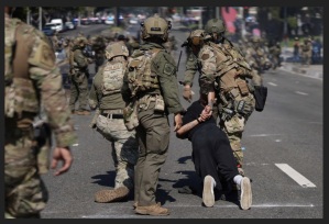 ICE agents dragging a detained person