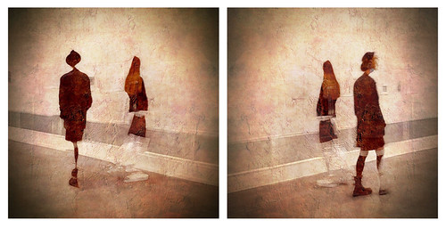 mirror images of two women walking in different directions